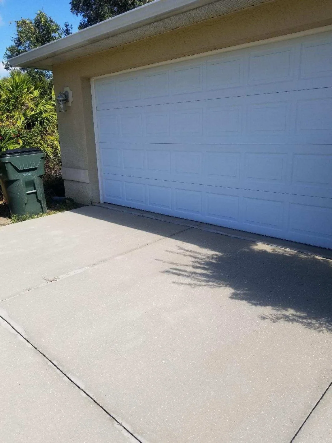 Clean driveway and garage exterior
