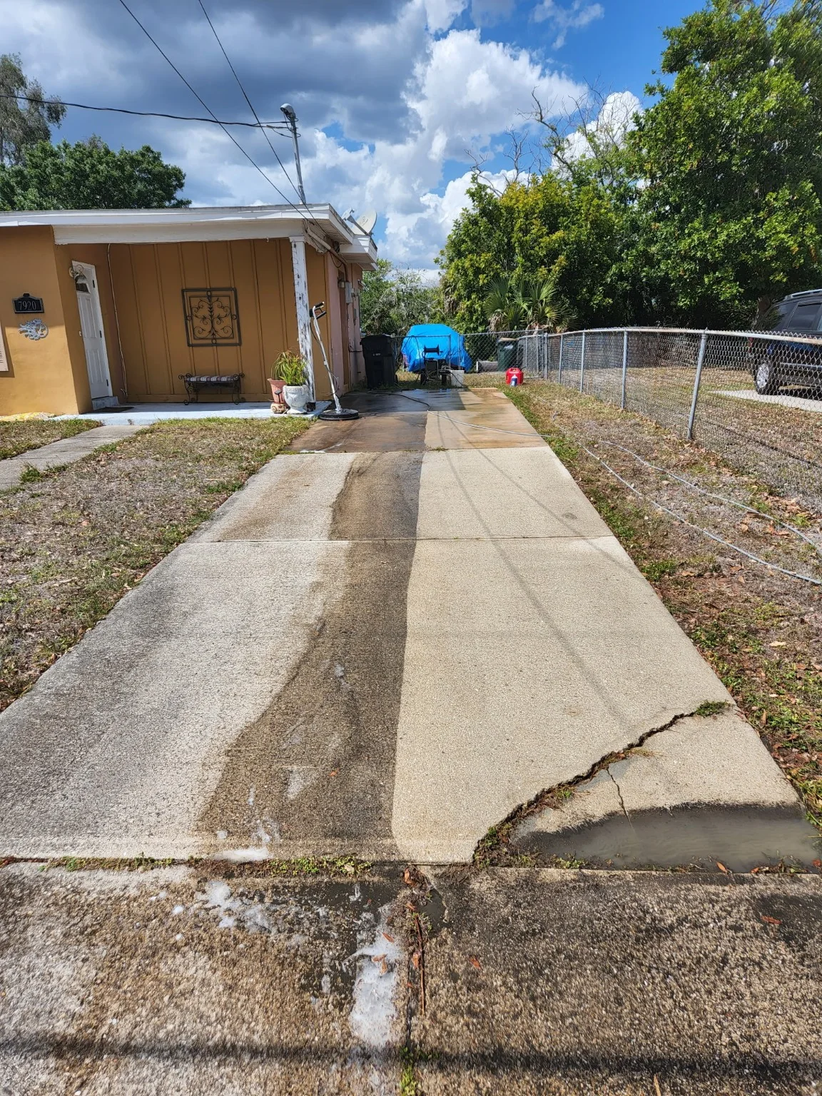 Driveway cleaning with a visible clean and dirty section